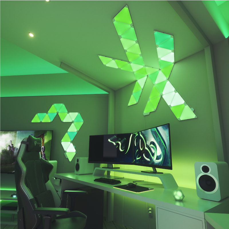 Nanoleaf Light Panels color-changing triangle smart modular light panels mounted to a wall in a gaming room. Similar to Philips Hue, Lifx. HomeKit, Google Assistant, Amazon Alexa, IFTTT.